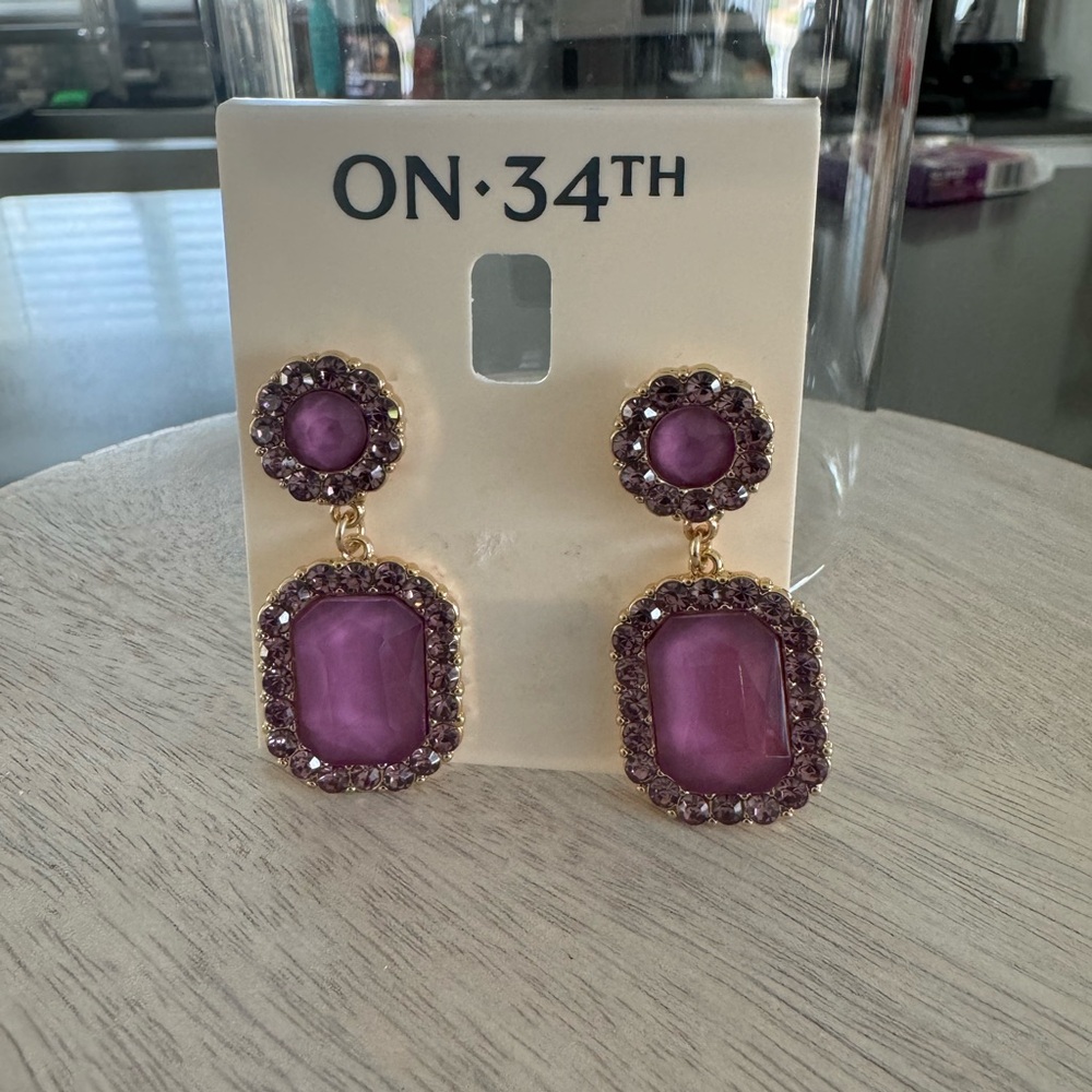 On 34th NWT Purple stone with Gold hardware Statement Earrings.